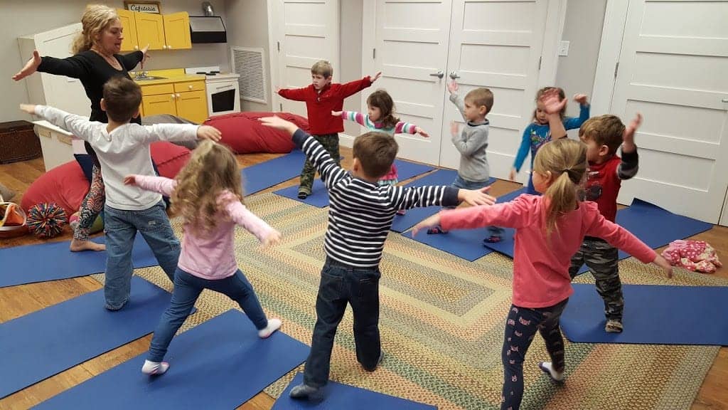 Children's are doing Animal Yoga in small apartment